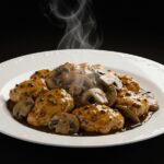 Final presentation of Black Pepper Chicken with Mushrooms, highlighting the tempting flavors and vibrant colors.