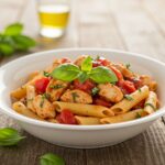 Delicious Easy Bruschetta Chicken Pasta served in a bowl, showcasing the vibrant colors and fresh ingredients in a perfect meal presentation.