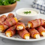 Final presentation of hot bacon wrapped mozzarella sticks, showcasing deliciousness for appetizer lovers.