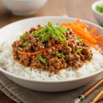 Delicious Korean Ground Beef Bowl presentation with perfectly cooked beef, rice, and vibrant garnishes for an appetizing meal.