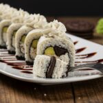 Deliciously presented Oreo cheesecake sushi roll featuring creamy filling and crunchy Oreos, perfect for dessert lovers looking for a sweet treat.