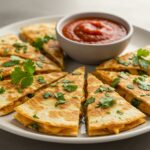 Deliciously plated 5-Minute Pepperoni Pizza Quesadilla wedges, garnished and ready to enjoy with marinara dipping sauce.