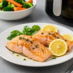 Delicious air-fryer salmon steaks garnished and ready to serve, a healthy and flavorful meal option.