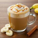 Final presentation of a delicious Banana Bread Latte topped with whipped cream and caramel, perfect for coffee lovers seeking a unique flavor experience.