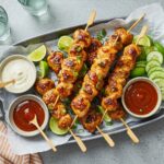 A stunning display of completed Bang Bang Chicken Skewers on a platter, perfect for summer gatherings with vibrant colors and flavors.