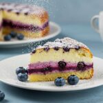 A delectable slice of Blueberry Boyfriend Bait served on a plate, highlighting its inviting texture and fresh blueberry flavor.
