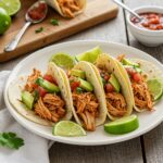 Final presentation of chicken street tacos with vibrant toppings and an inviting rustic setting, showcasing a delicious street food experience.