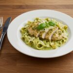 Delicious creamy pesto chicken delight presentation, showcasing vibrant flavors and fresh ingredients.