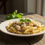 Final presentation of Creamy Tuscan Chicken Penne, showcasing the creamy sauce, chicken, and pasta with vibrant colors, perfect for appetizing images.