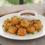 Crispy Air Fryer Honey Garlic Salmon Bites - the final presentation of delicious salmon bites served with a tasty dipping sauce.