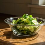 Vibrant Cucumber Salad in a glass dish, beautifully garnished for a fresh and appetizing presentation, highlighting Din Tai Fung style.