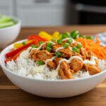 Final presentation of Easy Buffalo Chicken Bowls with savory buffalo chicken, fresh veggies, and added garnishes for a delicious meal.