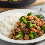 Delicious Easy Honey Garlic Ground Beef and Broccoli, plated with rice and sesame garnish, perfect for a quick and satisfying dinner.