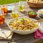 Final presentation of Easy Mexican Street Corn Pasta Salad at a picnic, showcasing vibrant colors and inviting textures.