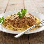 Delicious and creamy ground beef pasta served in a rustic setting, perfect for a one-pan dinner experience.