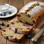 Artfully presented blueberry zucchini bread, showcasing its moist texture and the burst of blueberries, perfect for a delightful snack or breakfast.