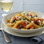 Gourmet presentation of Greek Pasta with Feta and Olives, showcasing vibrant colors and textures, perfect for a delicious meal.