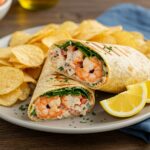 Finished Grilled Shrimp Caesar Wrap, showcasing the vibrant filling and garnishes, ideal for a delicious, healthy meal presentation.
