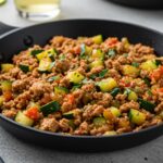 Deliciously plated Ground Turkey and Zucchini Skillet on a dining table, perfect for a hearty meal.