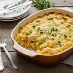 Delicious and healthy Chicken Cauliflower Rice Casserole served on a rustic table, perfect for a wholesome family meal.