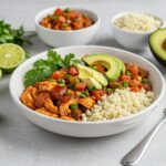 Final presentation of Healthy Chicken Enchilada Bowls with colorful garnishes and fresh ingredients.