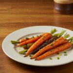 Delicious honey garlic butter roasted carrots presented beautifully, highlighting their rich color and tasty presentation as a side dish.
