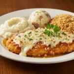 Final presentation of Longhorn Steakhouse Parmesan Chicken on a rustic table, highlighting its delicious and inviting appearance.