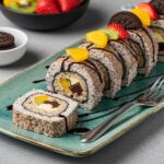Cut pieces of Oreo Cream Cheese Cheesecake Sushi Roll on a plate, showcasing a unique dessert ready to delight with flavors and presentation.
