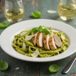 Delicious bowl of Pesto Pasta with Parmesan Chicken Perfection, showcasing vibrant colors and textures, ideal for food lovers and perfect dining experience.