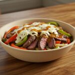 Final presentation of Philly Cheesesteak Bowl, showcasing delicious steak, fresh vegetables, and melted cheese, a perfect low-carb dinner ready to serve.