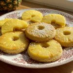 Delicious pineapple upside sugar cookies elegantly presented on a plate, garnished with fresh pineapple, perfect for a delightful dessert experience.