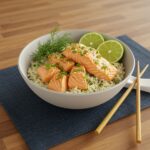 A beautifully presented Salmon Rice Bowl on a wooden table, highlighting the flavors of salmon, rice, and vegetables in a delicious meal.