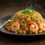 Delicious shrimp fried rice served on a plate, showcasing a vibrant and appetizing meal.