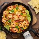 Delicious and vibrant Shrimp Street-Corn Skillet served in a cast-iron pan, showcasing the perfect blend of seafood and corn for a flavorful dish.