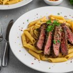 Deliciously plated Sweet and Spicy Garlic Steak Pasta with vibrant colors, garnished and ready to serve, showcasing a perfect meal.