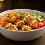Final presentation of the BEST Bang Bang Chicken Bowl, colorful and appetizing meal, creamy, crispy, and delicious chicken bowl.