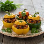 Colorful and appetizing Zucchini-Black Bean Stuffed Peppers beautifully presented on a plate, garnished with cilantro and showcasing the delicious filling.